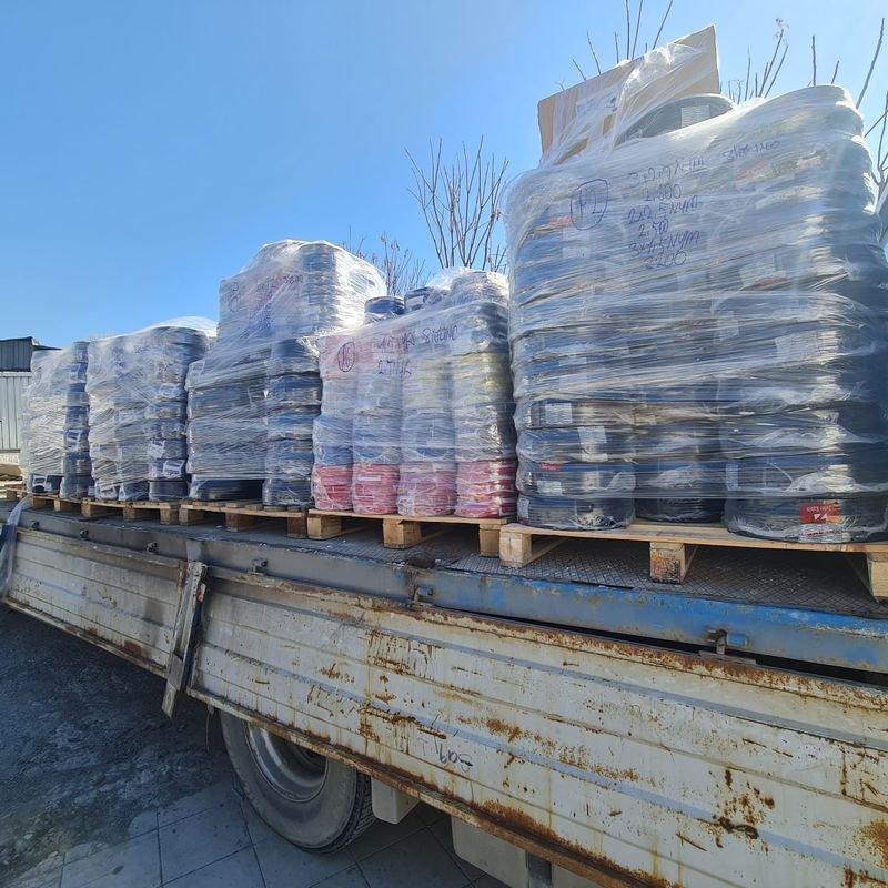 Stretch-wrapped pallets loaded on a flatbed truck